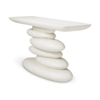 Angled view of the Azura white console table showing its slim tabletop and stacked-pebble base