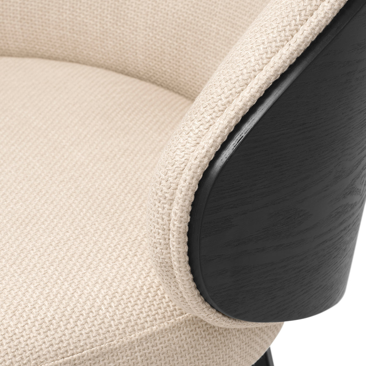 Close-up of Camerota Scalea sand upholstery edge and black wooden back