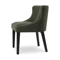 Side view of the Chavelle dining chair showing its Torrin green velvet seat and curved back