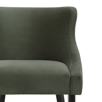 Close-up of the Chavelle dining chair green velvet backrest and upholstered seat