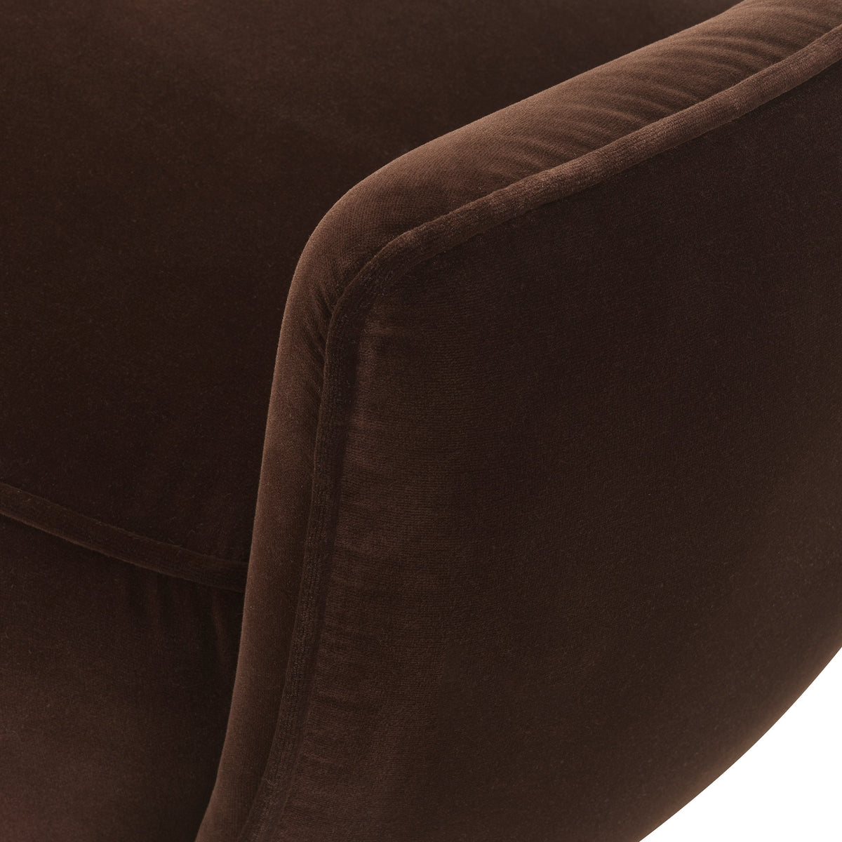 Close-up of Stirling Sonoma brown velvet and piped arm edge